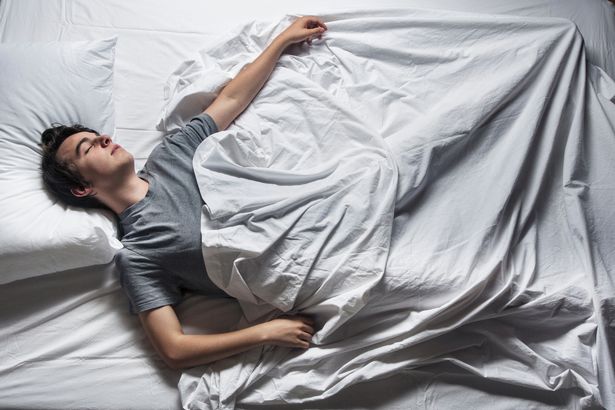 0 Man asleep in a bed