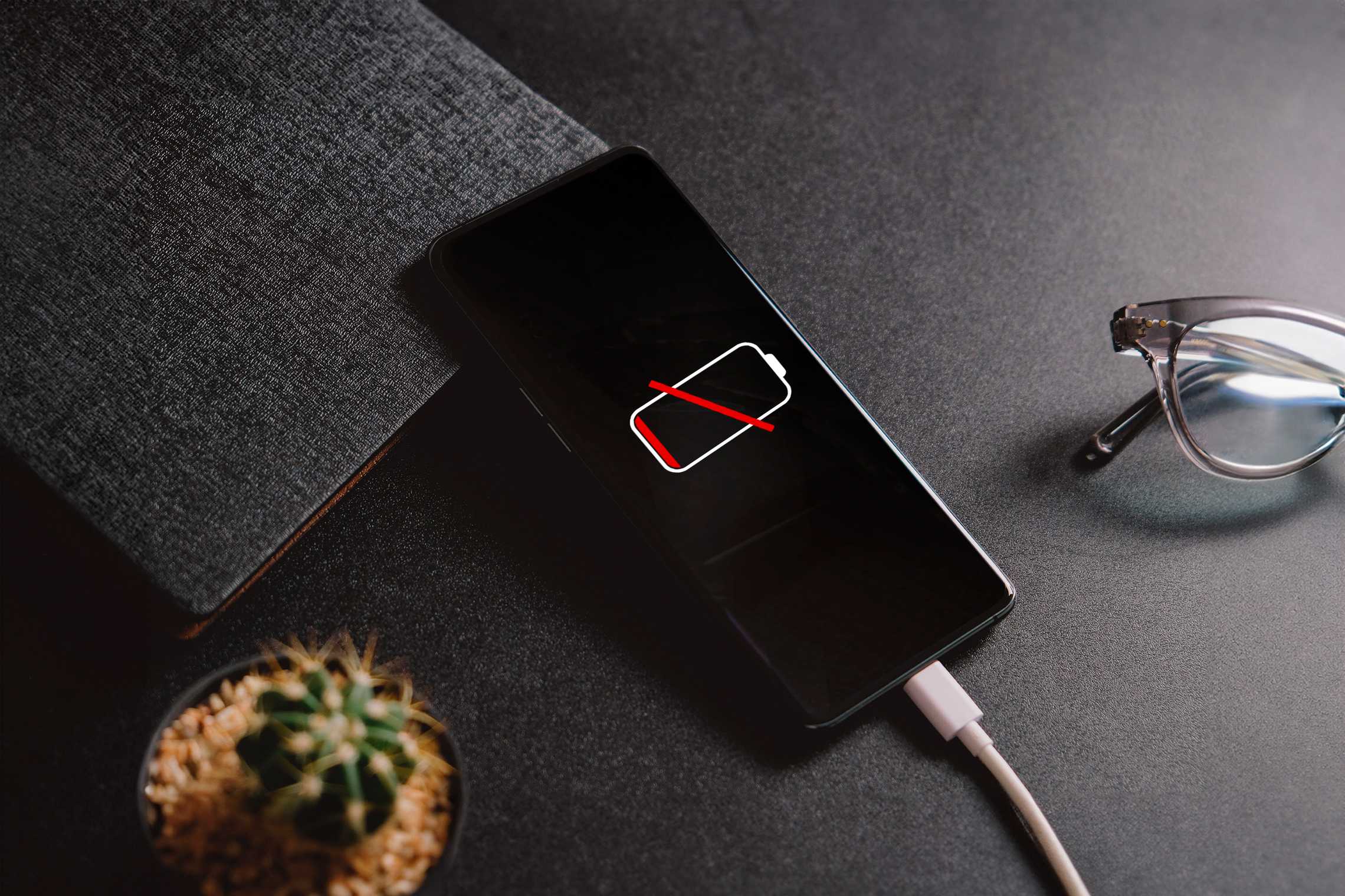 an android with a dead battery charging
