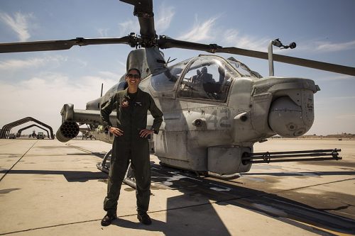 800px Major Jasmin Moghbeli with an AH 1 Cobra helicopter in July 2017